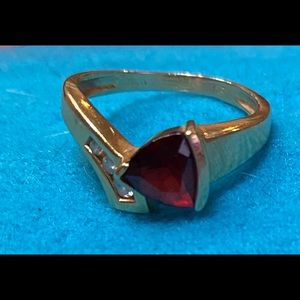 Gold and garnet ring
